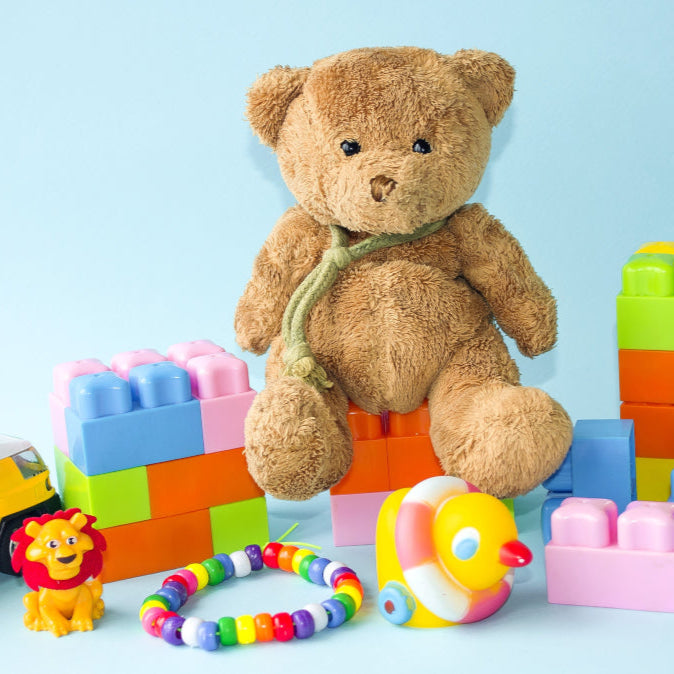 Baby playing with colorful toys designed for early childhood development and learning